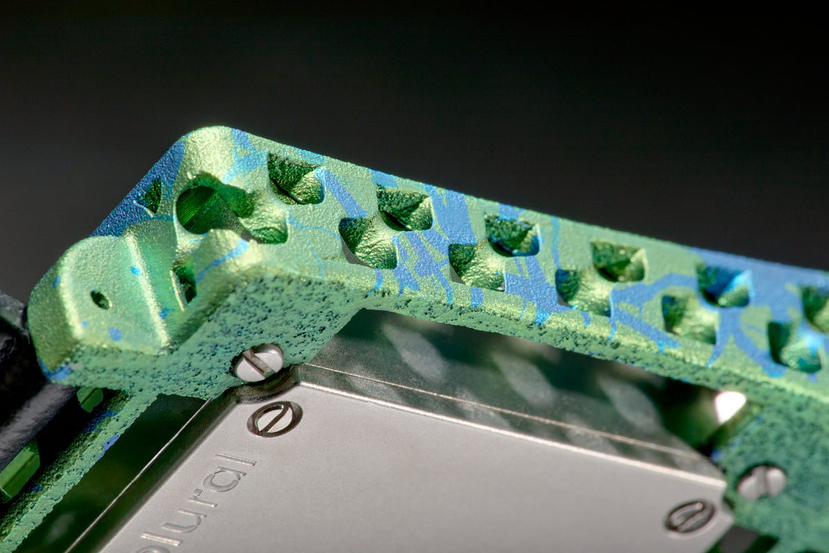 Close-up showing the color and surface texture of anodized titanium.